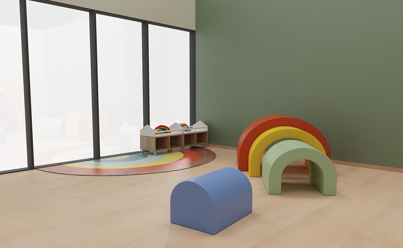 Gruppenraum Regenbogen Gruppenraum Regenbogen mit Kriechtunnel Regenbogen, Regenbogenteppich und EduCasa Regal mit Lauflernstangen