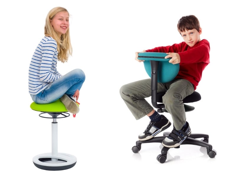 Konzentration Sitzmöbel Schülerin auf einem Hocker und Schüler auf einem Stuhl